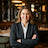 portrait of a professional female restaurant owner in business attire with blurred upscale bistro background